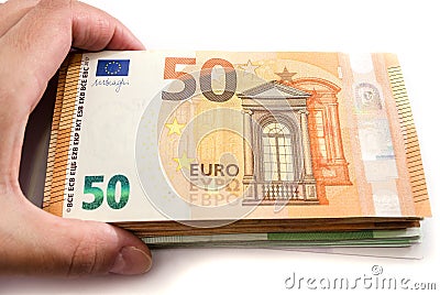 Stack of euro banknotes in a hand. View from above. Close-up. Stock Photo