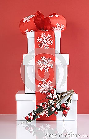 Stack of festive red and white theme Christmas gift boxes Stock Photo