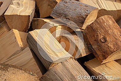 Stack of firewood. Chopped logs background. Woodpile background. Stacked wood. Wooden texture. Logging storage Stock Photo