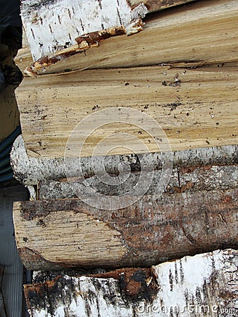 Stack of firewood, wood logs texture background.Pile of chopped fire wood prepared for winter Stock Photo