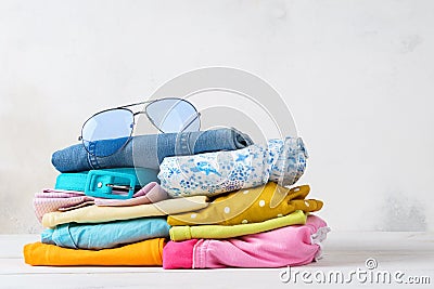 Stack of folded colorful clothes. Modern casual clothing. Stock Photo