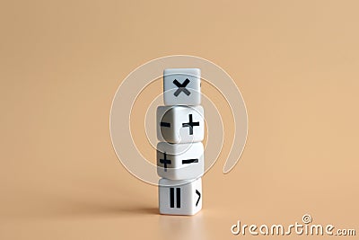 The stack of four dice with arithmetic operation symbols on soft orange background. Stock Photo