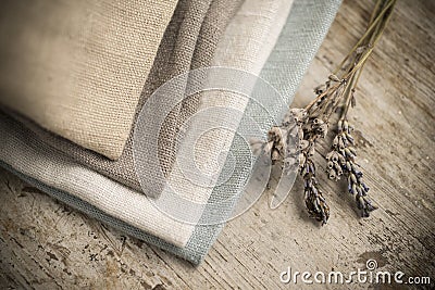 Stack of Four Folded Dull-Colored Cotton Fabric Stock Photo