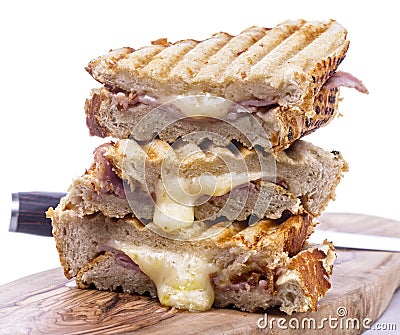 Stack of freshly cooked cheese and ham toasted sandwiches Stock Photo