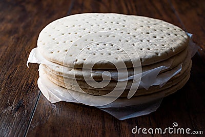 Stack of Frozen Pizza Base or Dough Stock Photo