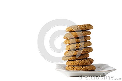 A stack of gingerbread cookies on a white plate isolated on white background with copy space Stock Photo