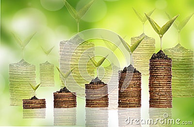 Stack golden coin with reflection over green background Stock Photo