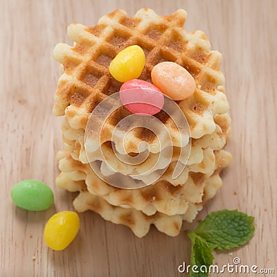 A stack golden waffle with candy. Stock Photo