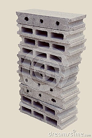 Of stack gray bricks, one with an open hole and the other with multiple small holes Stock Photo