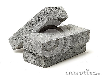 Stack of gray clay bricks for construction Stock Photo