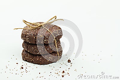Stack of healthy chocolate, almond and chia seed cookies on white Stock Photo