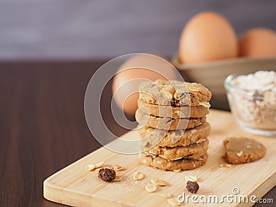 Stack healthy homemade oat cookies on wooden boards with egg. Stock Photo