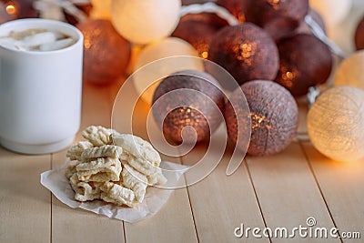 Stack home mom`s cookies on wooden natural background. In the background glow round headlights. Stock Photo