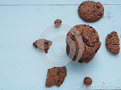Stack homemade double chocolate chip cookies on blue wooden background. Stock Photo