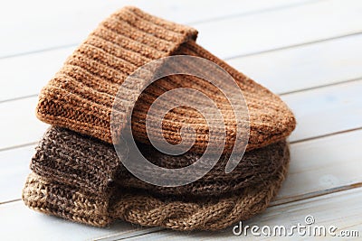 Stack of homemade knitted hats Stock Photo