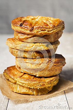 Stack of homemade meat pies on a rustic table Stock Photo