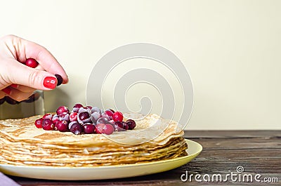 Stack of homemade thin pancakes with cranberries,stack of homemade thin pancakes with cranberries, Stock Photo