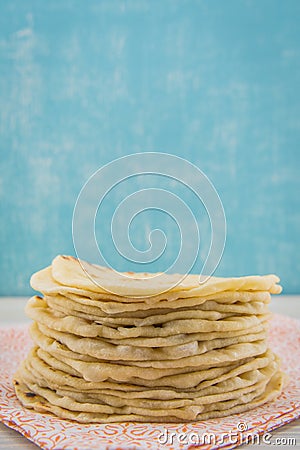 Stack of Homemade Tortillas on Orange Napkin Stock Photo