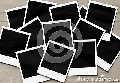 Stack of instant photos Mockup. Pile of retro photographs on wooden 3D rendering Stock Photo