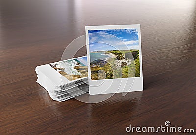 Stack of instant photos on wooden surface 3D rendering Stock Photo