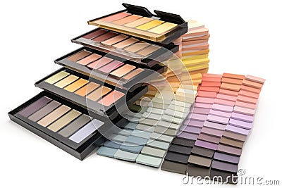 stack of makeup palettes, each filled with a different color scheme Stock Photo