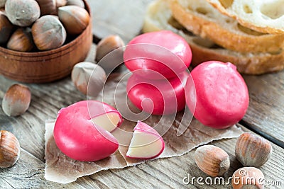 Stack of mini cheese with fuet slices and hazelnuts Stock Photo