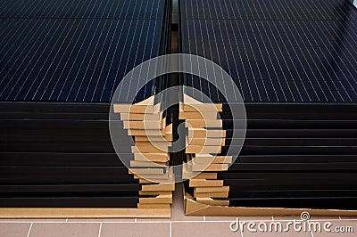 Stack of new solar panel ready for installation Stock Photo