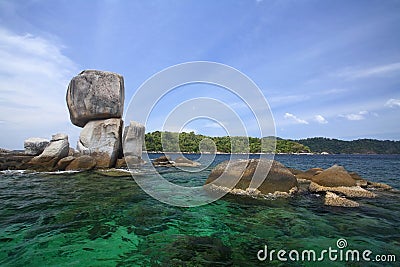 Stack natural stone arch above turquoise sea, Ko Lipe island Stock Photo