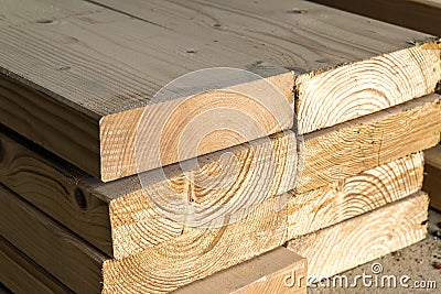 Stack of new wooden studs at the lumber yard. Wood timber constr Stock Photo