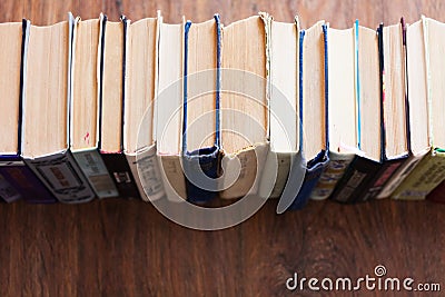 Stack of old book on wooden table, education concept background, many books piles with copy space for text Editorial Stock Photo