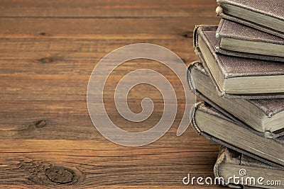 Stack Of Old Books With Copyspace On Wood Background Stock Photo