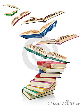 Stack of Old books and flying books Stock Photo