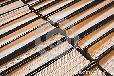 Stack of old books. Pile of vintage books. Literature and school concept. Library concept. Book shelf close up. Books background. Stock Photo