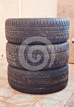Stack of old car tire with erased tread Stock Photo