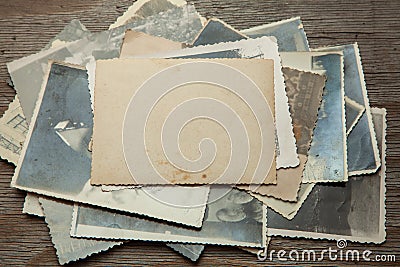 Stack old photos on table. Mock-up blank paper. Postcard rumpled and dirty vintage Stock Photo