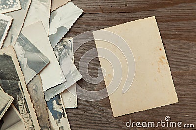 Stack old photos on table. Mock-up blank paper. Postcard rumpled and dirty vintage Stock Photo