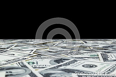 Stack of one hundred dollar bills isolated on black background. Stack of cash money in hundred dollar banknotes. Heap of hundred d Stock Photo