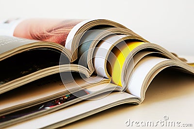 Stack of open printed magazines Stock Photo