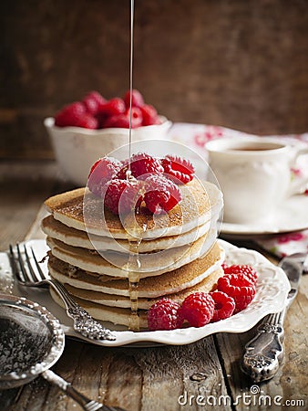 Stack of pancakes with fresh raspberries. Stock Photo