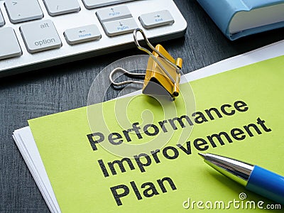 Stack of papers with Performance Improvement Plan PIP. Stock Photo