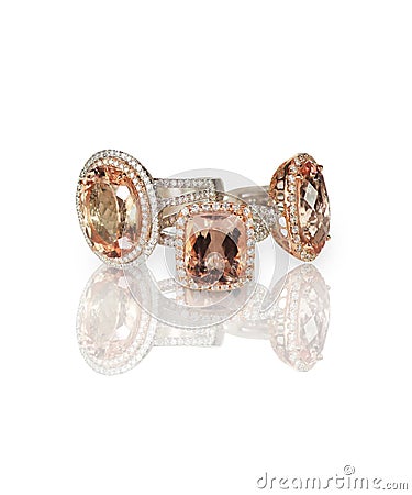 Stack of pink morganite diamond halo set engagment fashion rings Stock Photo