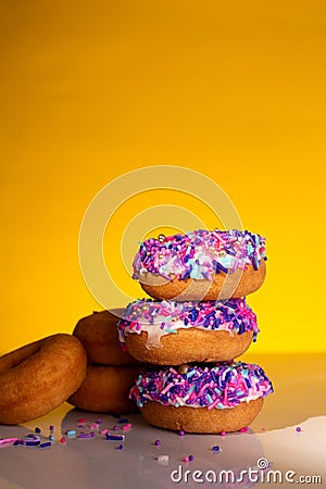 A stack of pink sprinkle donuts Stock Photo