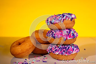 A stack of pink sprinkle donuts Stock Photo