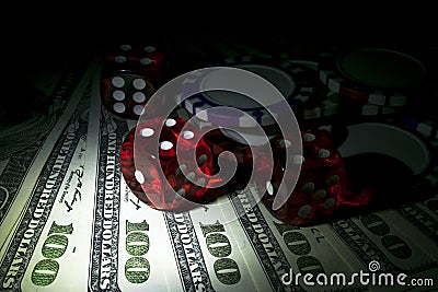 Stack of Poker chips with dice rolls on a dollar bills, Money. Poker table at the casino. Poker game concept. Playing a game Stock Photo