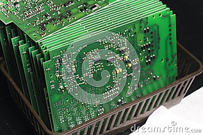 Stack of produced printed circuit boards with surface mounted components. Stock Photo