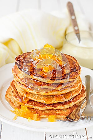 A Stack of Pumpkin Pancakes Topped with Pumpkin-in-Syrup Preserves Stock Photo