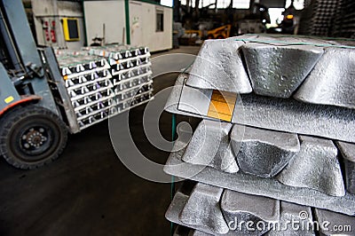 Stack of raw aluminum ingots in aluminum profiles factory Editorial Stock Photo