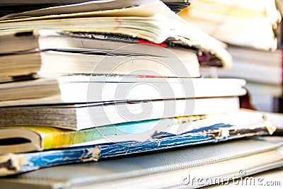 Stack of recycling paper on white. Pile of old books. Old open books close up Stock Photo