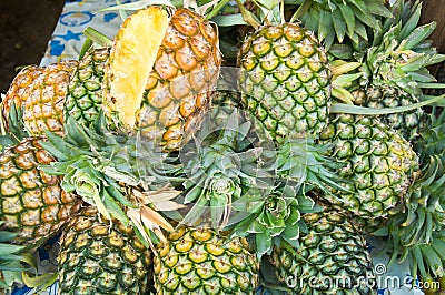 Stack of ripe many pineapples Stock Photo