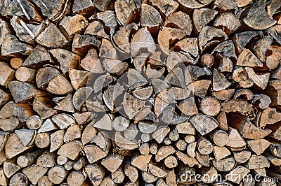 Stack of sawn tree logs. Stacked pile of firewood logs. Lumber industry. Wooden background Stock Photo